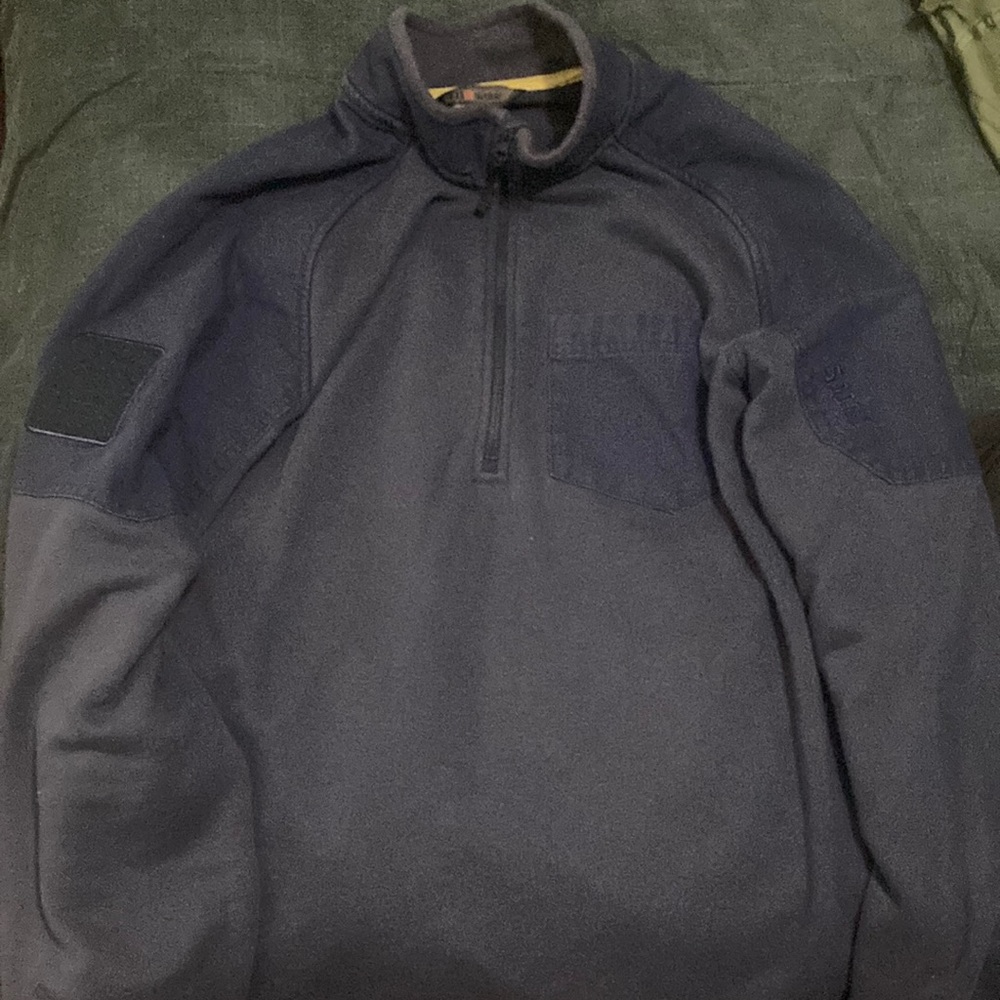 5.11 tactical, size XL, 1/4 zip up in navy blue and has a front pocket